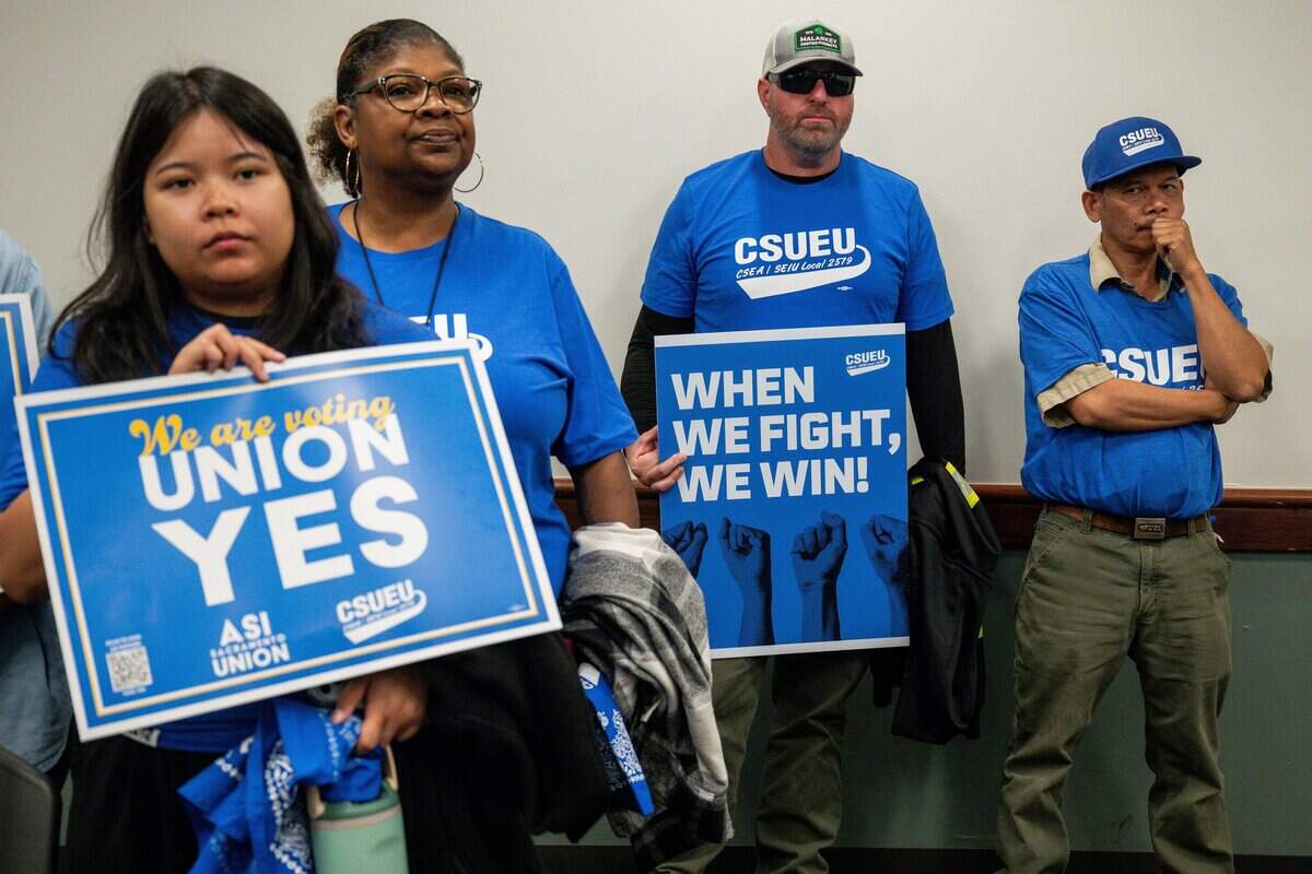Members of California State University Employees Union hold slogan during a group meeting following a bargaining session between the union and California State University at Sac State Student Union in Sacramento on Wednesday, Sept. 2, 2026.